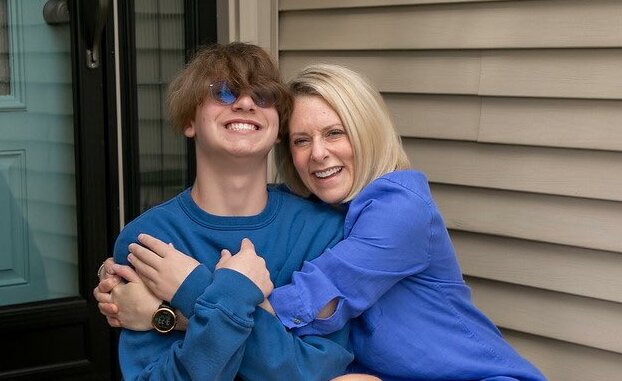 Emily Busch hugging her son