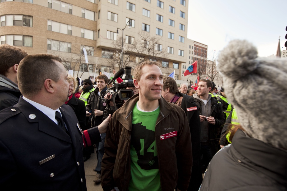 A (much) younger Sen. Larson getting escorted