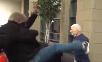 Republican at Johnson County assaulting Biden dummy