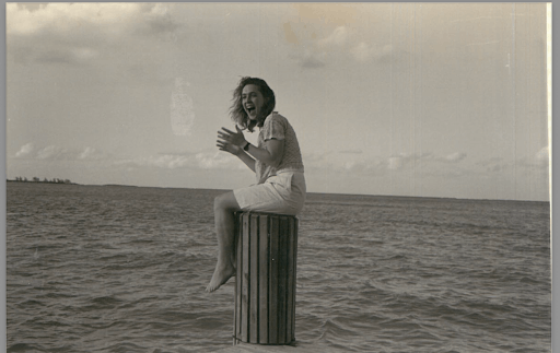 Black and White photo of Kirsten Gillibrand in her 20s at the ocean