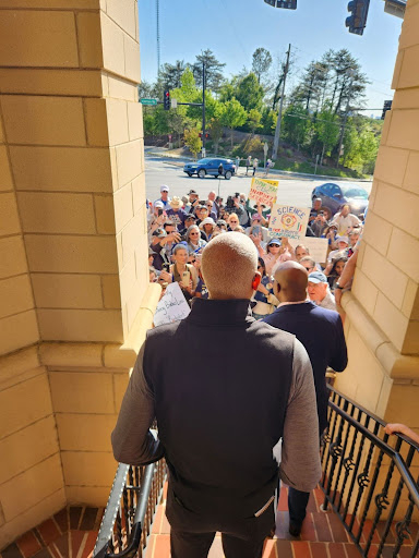 Hank at a protest with fired CDC workers
