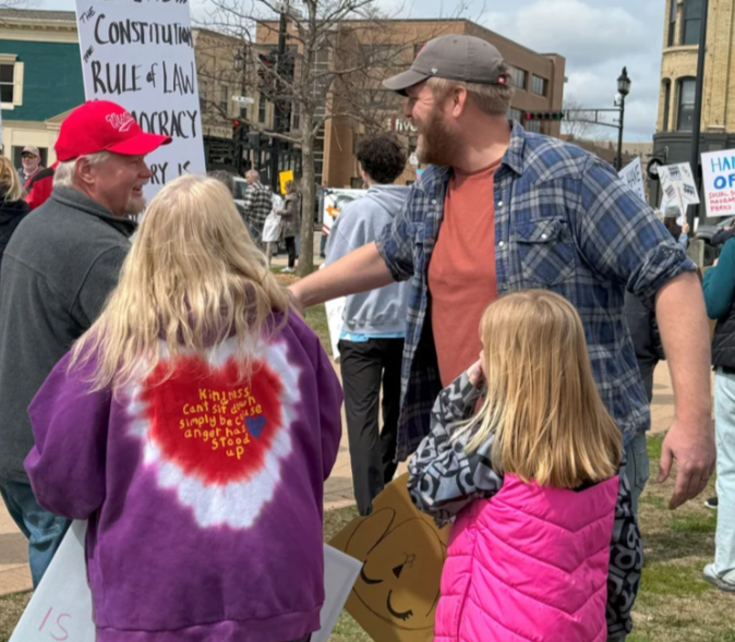 Mike meeting community members