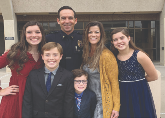 Tyler Kamp with his wife and four children