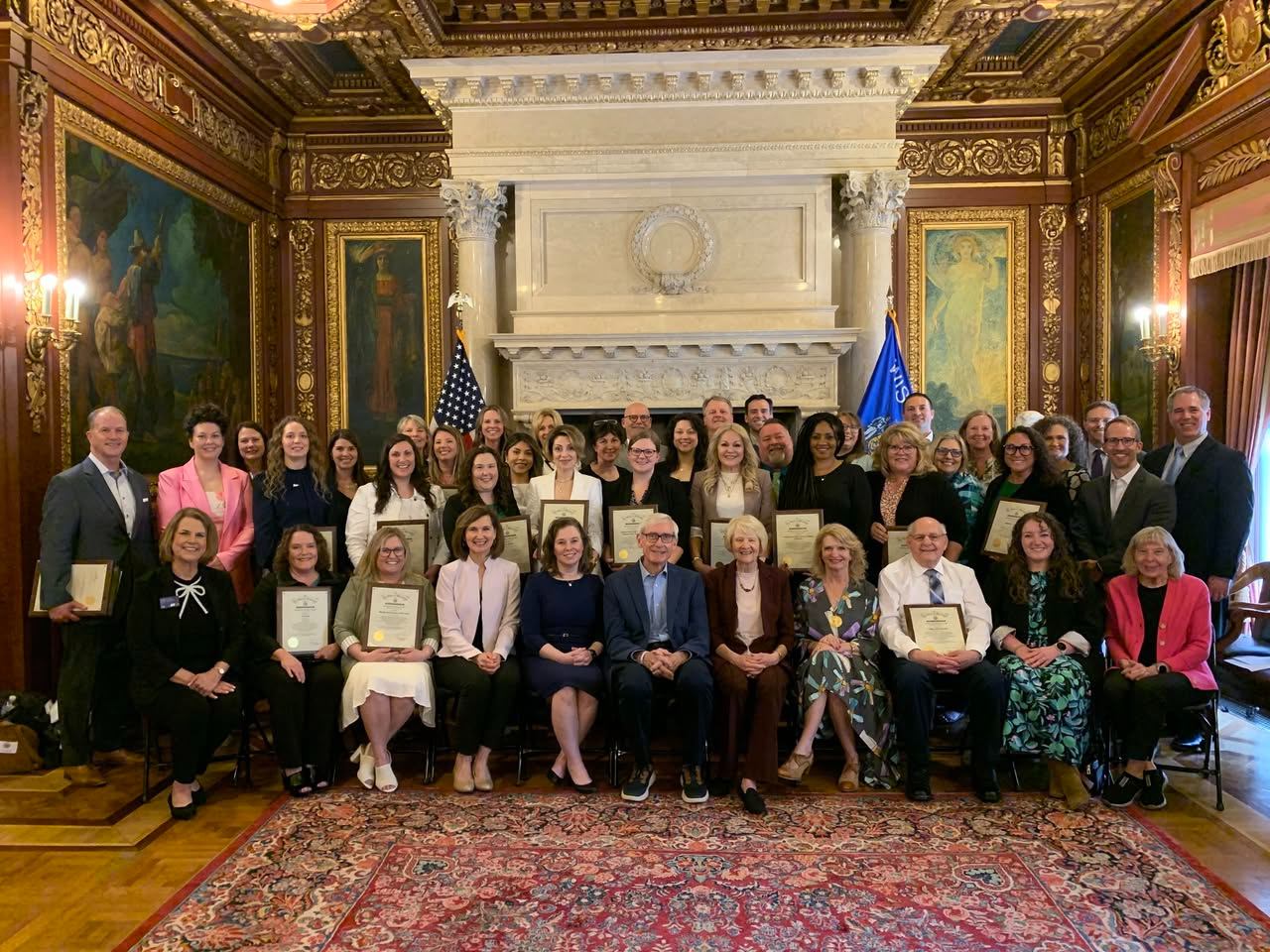 Sara Rodriguez with Governor Evers and the Wisconsin Department of Financial Institutions